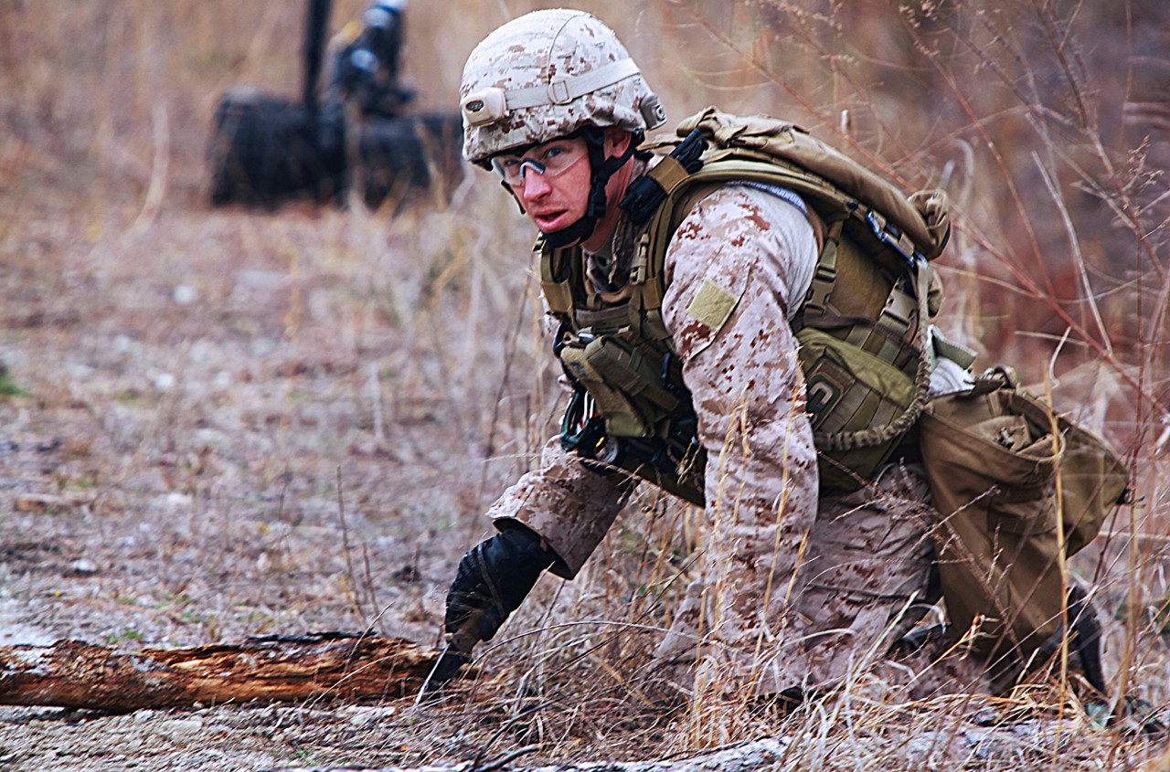 Marine in ground ordnance maintenance MOS in field.