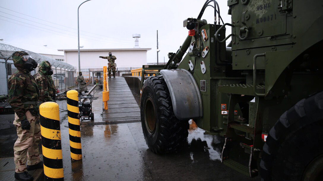 Marines sorting equipment and gear at base.