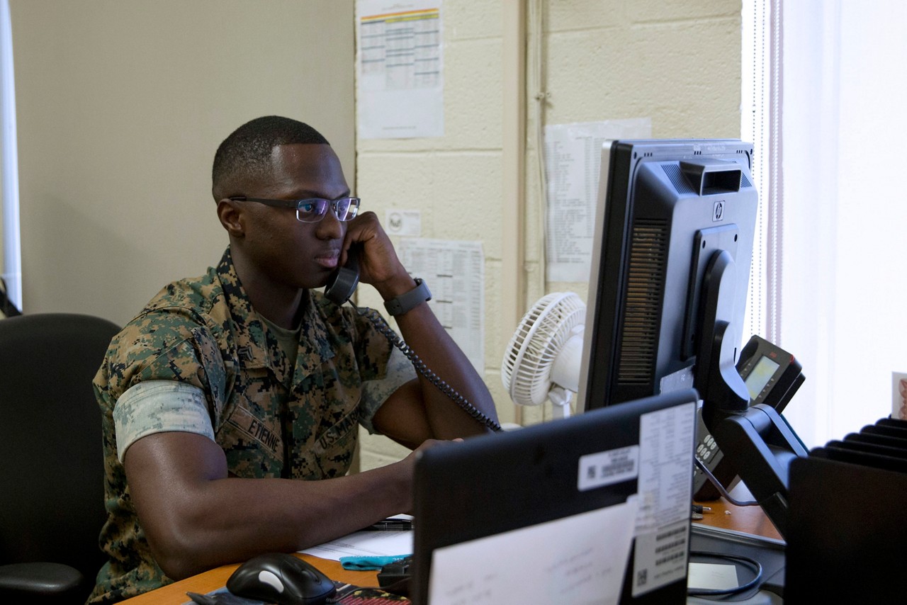 Marine in personnel and administration MOS field taking a phone call.