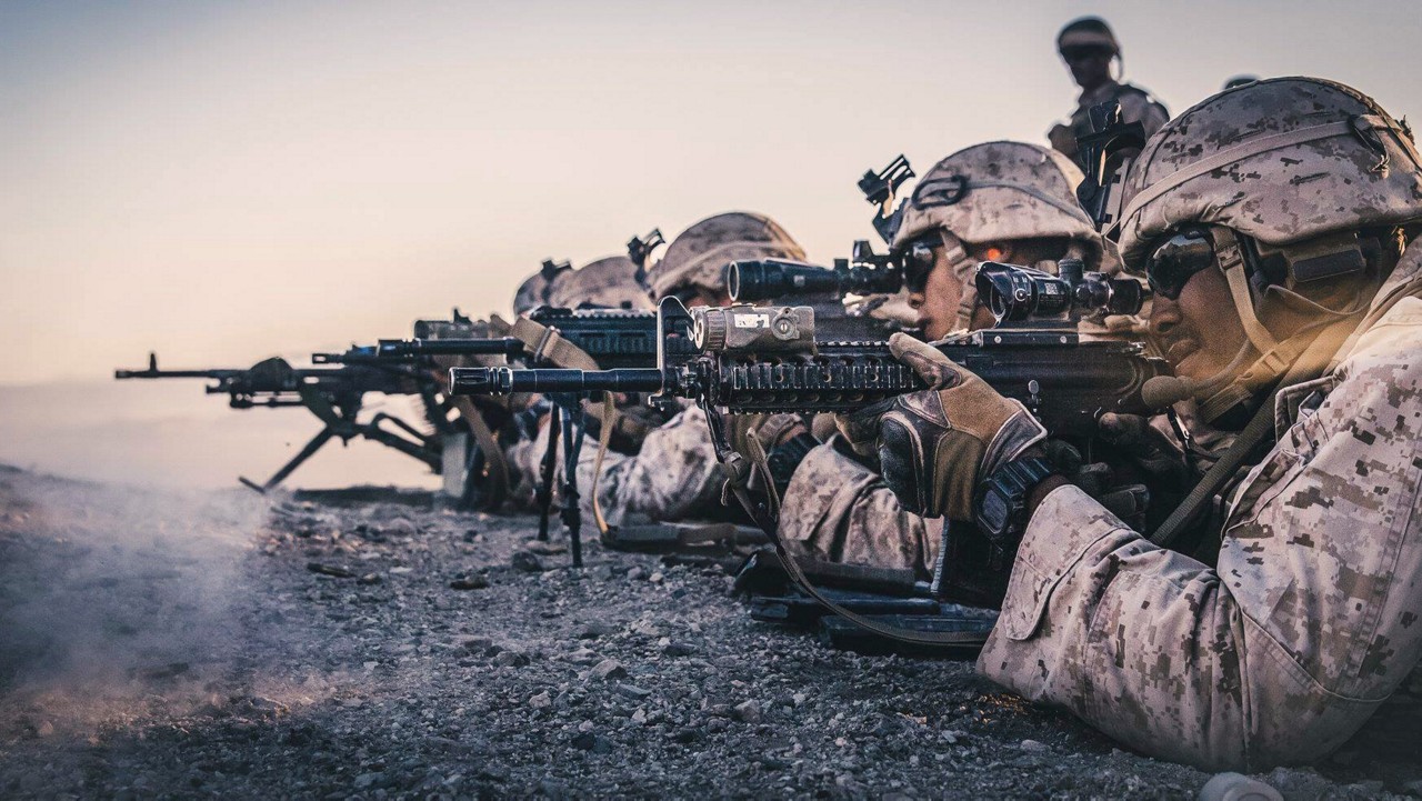 Marines in formation on beach.