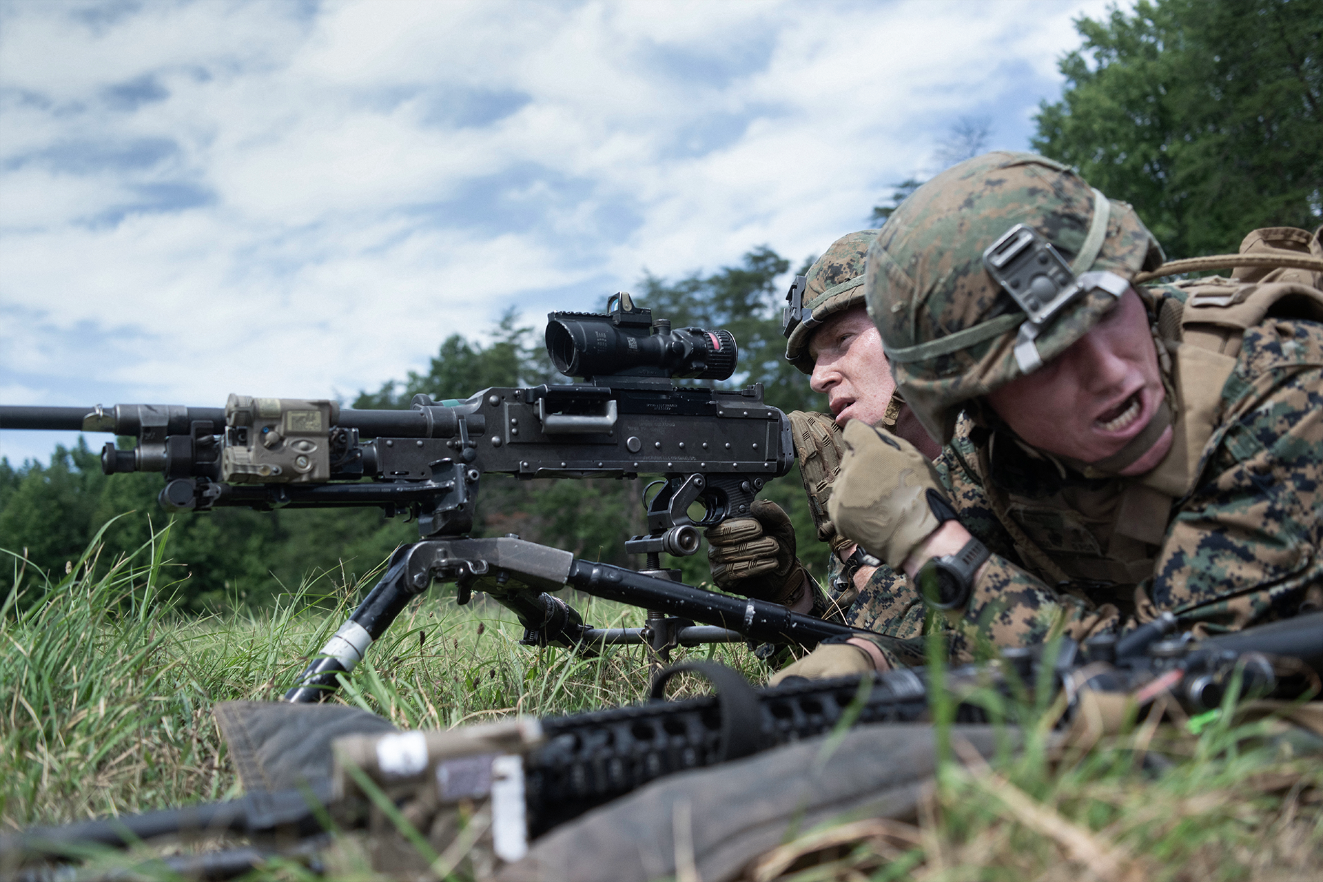 Marine officers with machine gun and optics conducting Phase 2 rifle squad leader training during Basic School weapons instruction.