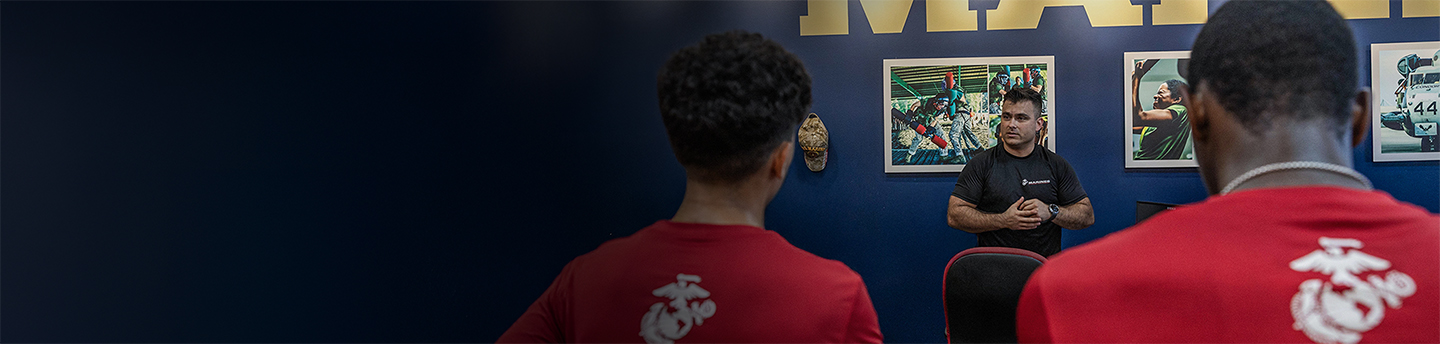 A Marine recruiter speaks with delayed entry program poolees at a local recruiting station.