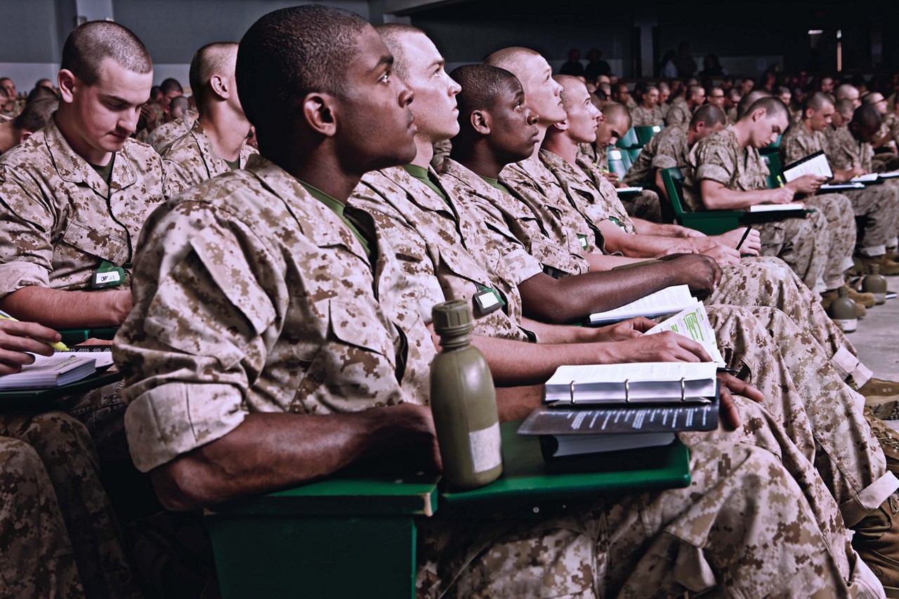 Marines enjoying education benefits while learning in class.