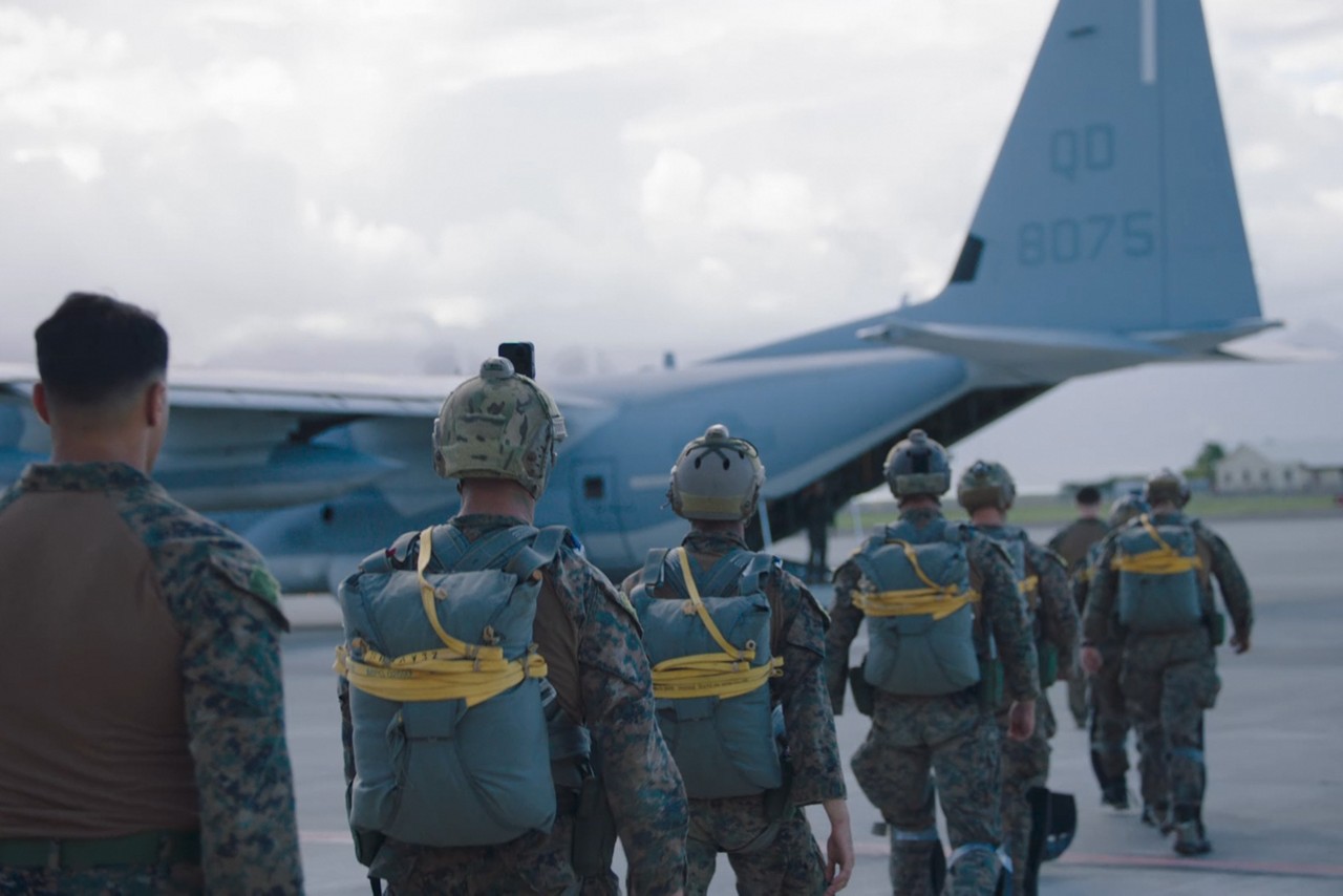 Marines delivering boxes of supplies.