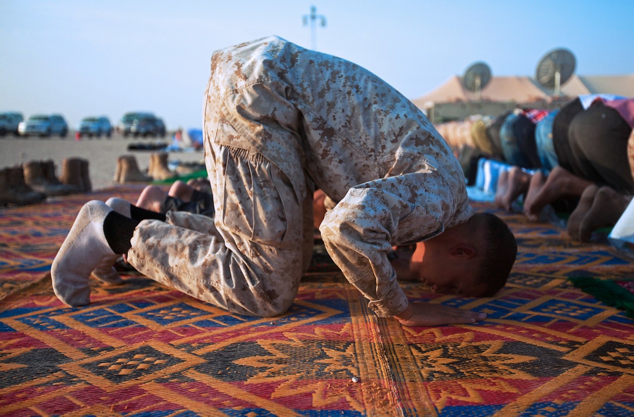 Cpl. Abdelbasset Jibbou, a towed artillery systems technician with 2nd Combat Engineer Battalion, 2nd Marine Division (Forward), and native of Ewing, N.J., prays during an Eid ul-Fitr ceremony aboard Camp Leatherneck, Helmand province, Aug. 30. Eid ul-Fitr, which marks the end of the month of Ramadan, was observed by hundreds of coalition service members and local nationals during a ceremony that included prayer and a sermon led by a Muslim chaplain.