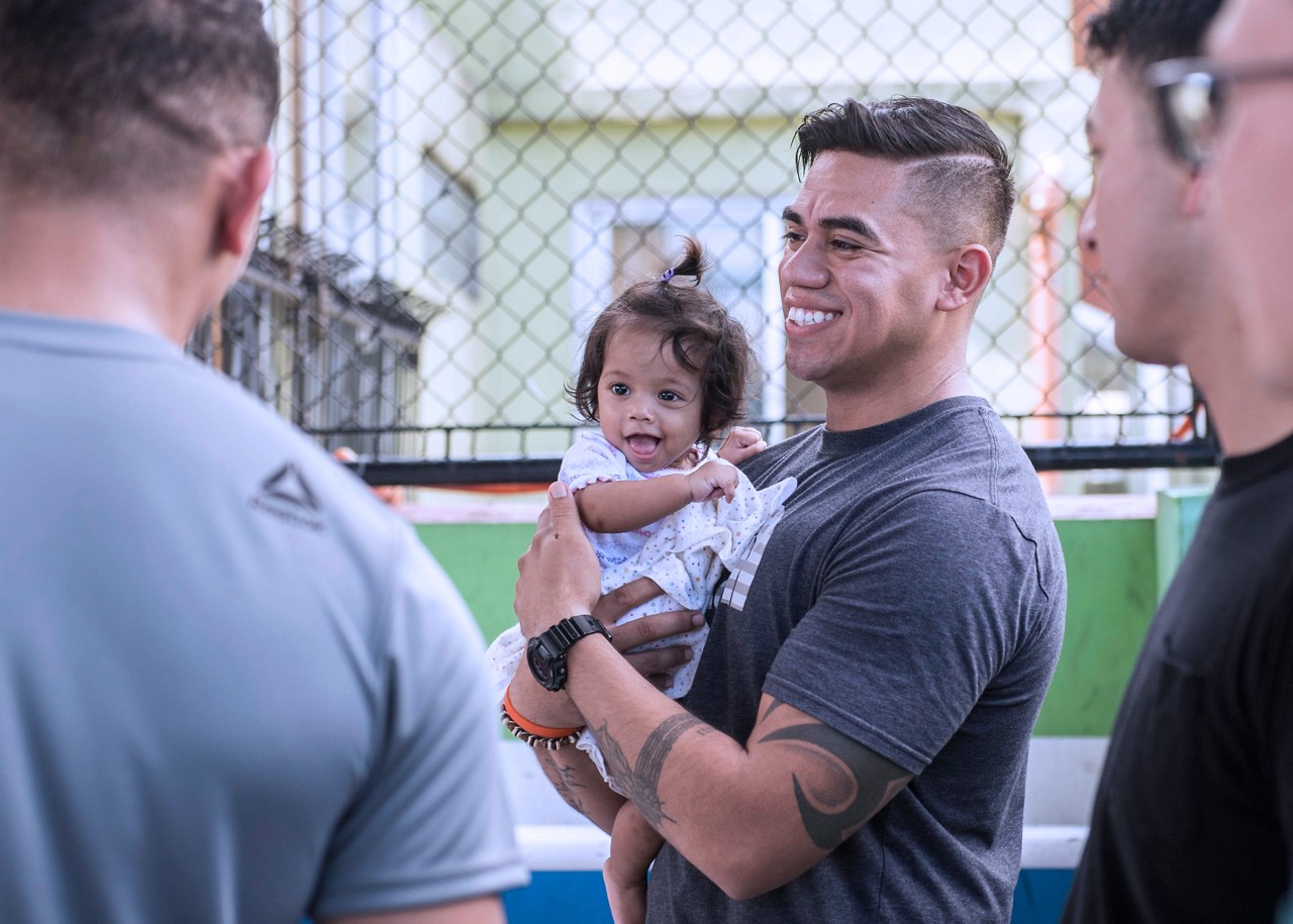 U.S. Marine Corps Staff Sgt. Richi Saldivar, native of Alexandria, Virginia, with Alpha Company, 7th Communications Battalion, 3rd Marine Information Group, holds a baby girl from the Gentle Hands Child Care Center, Quezon City, Philippines. Gentle Hands is a child and youth welfare agency that provide rescue and rehabilitation for medical, social, psychological, and educational needs of at-risk children and youth, and advocating for the rights of the children. Philippine, U.S., Australian, and Japanese service members spent Mother’s Day volunteering at the center as part of a community relations effort in the Philippines during exercise Balikatan May 13, 2018. Exercise Balikatan, in its 34th iteration, is an annual U.S.-Philippine military training focused on a variety of missions, including humanitarian assistance and disaster relief, counterterrorism, and other combined military operations held from May 7 to May 18. (U.S. Army photo by Sgt. Dahnyce Baucom)