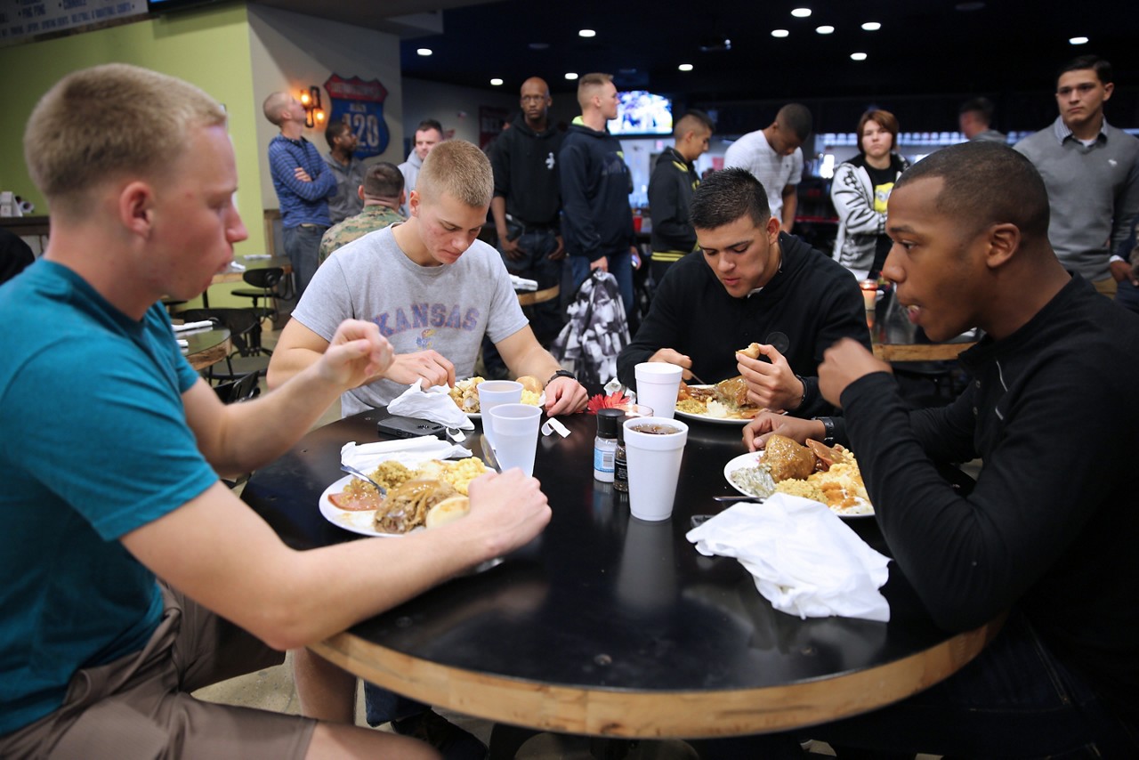 Marines and Sailors enjoy a traditional Thanksgiving meal with all the trimmings during a Thanksgiving celebration at the Roadhouse at Marine Corps Air Station Cherry Point, N.C., Nov. 27, 2014. Service members from the air station who weren’t able to be with family for the holiday enjoyed time together eating, playing games and watching football.