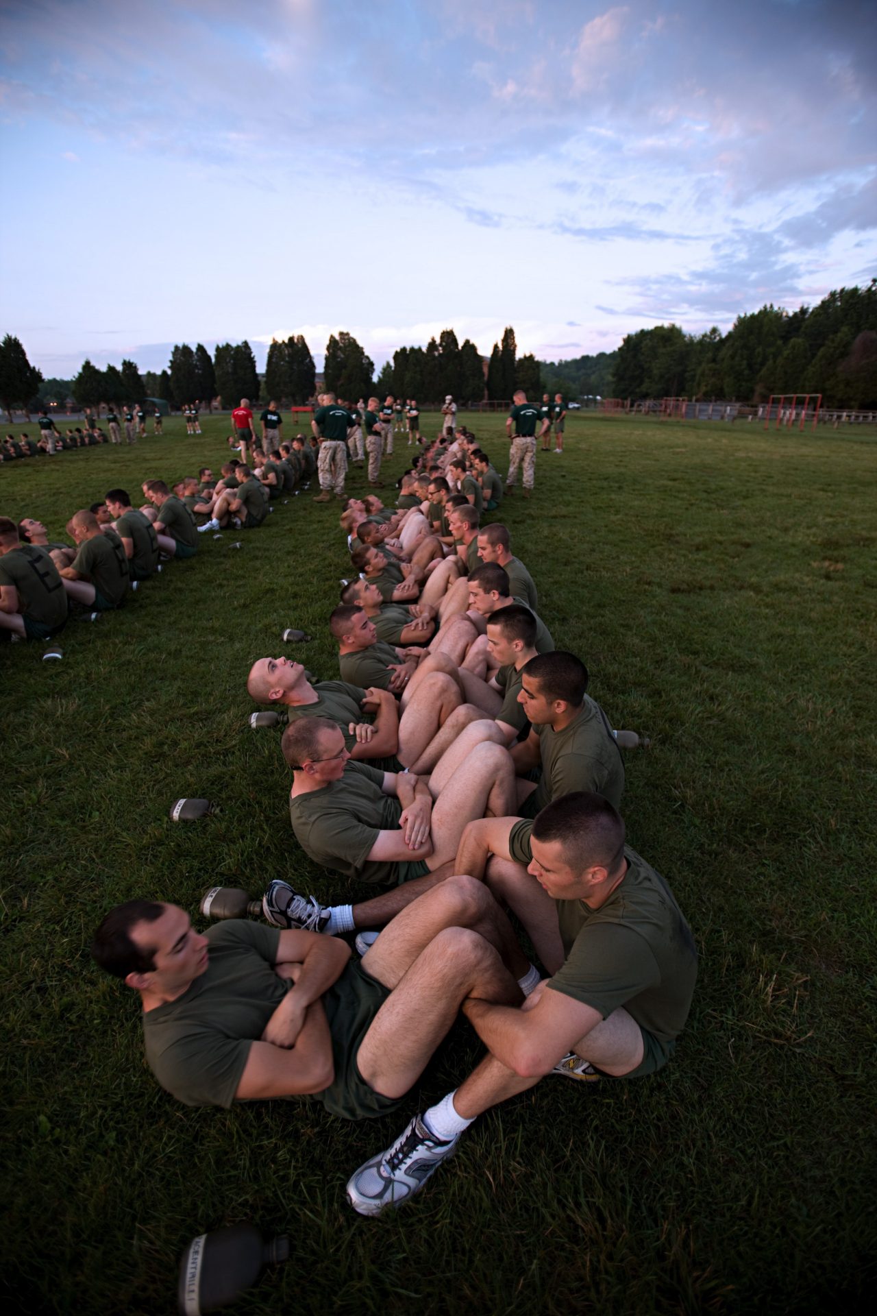 Aspiring Marines doing crunches as a group.