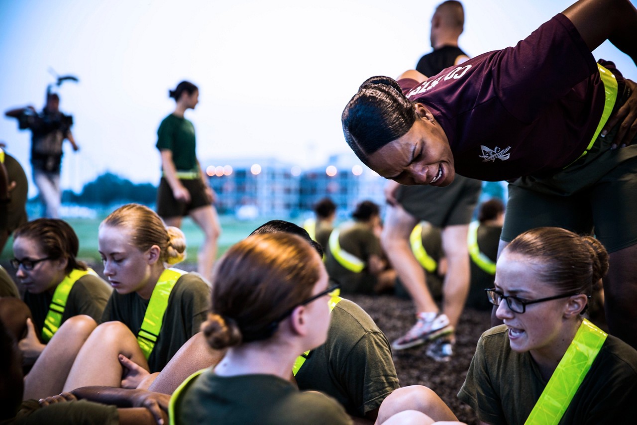 Aspiring Marine midway through doing a pull up.