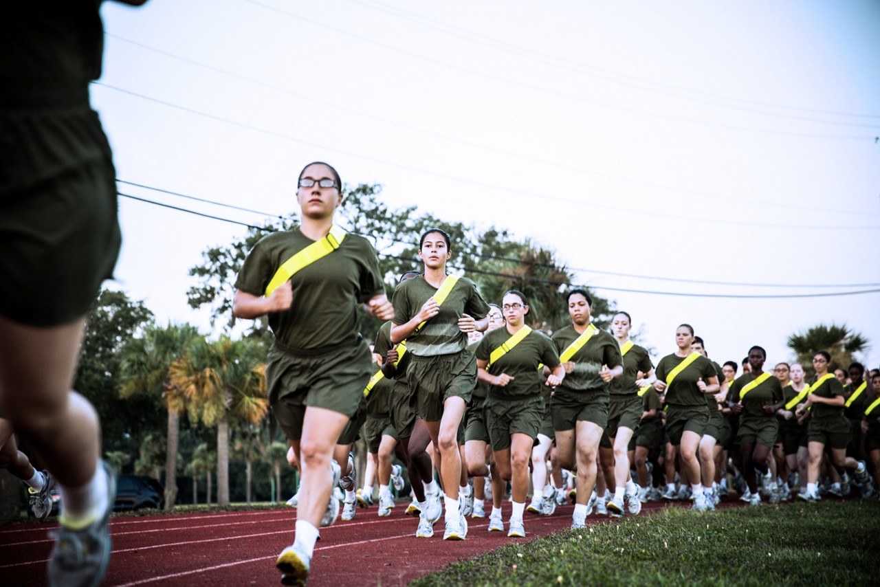 Aspiring Marine doing pull ups to showcase physical fitness.