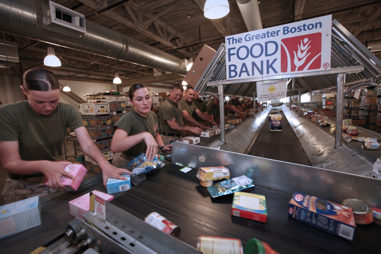 Marine Corp members sorting food bank items for The Greater Boston Food Bank.