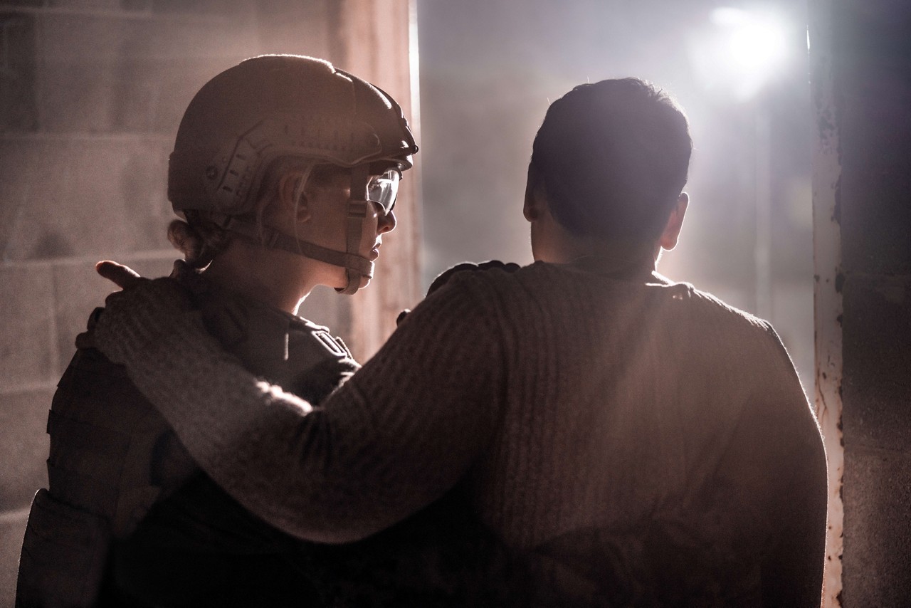 A U.S. Marine helps a civilian during a Humanitarian and Disaster Relief (HADR) mission. 